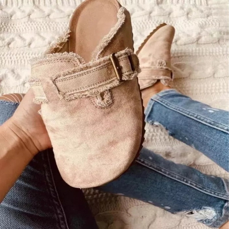 Women's faux suede wedge slippers in beige, featuring a comfortable buckle strap and casual style.